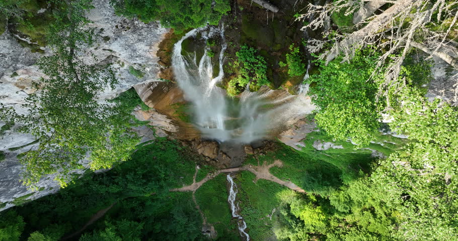 Beautiful waterfall in green forest, top view