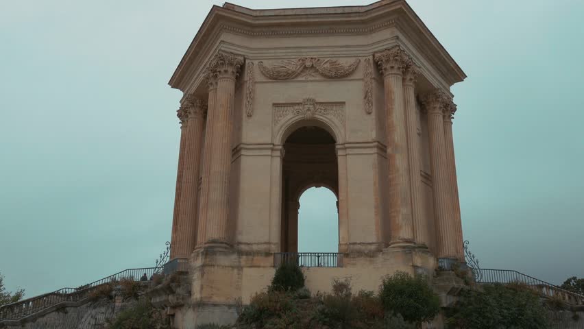 Château d’eau du Peyrou at the Bassin principal du Peyrou. The water building and pond at the promenade du Peyrou - Montpellier, France