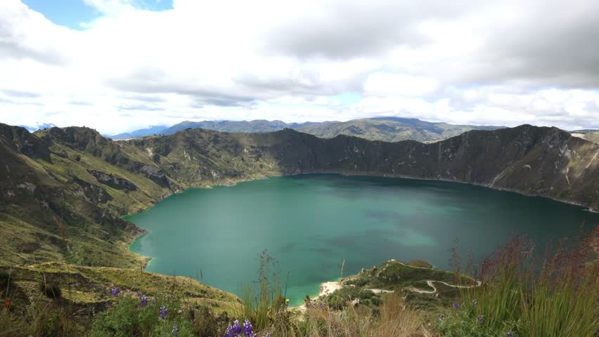 panoramic view of the incredible Quilotoa Volcano Lagoon, located at an altitude of 3,914 meters in the Ecuadorian Andes. This scenic landscape showcases the beauty of the turquoise crater lake