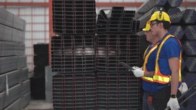 Two construction workers in safety gear and helmets inspect materials in a warehouse. They are discussing and analyzing data on a tablet, emphasizing teamwork, safety, and precision in construction ma - Powered by Shutterstock - Get 15% off with code: PIKWIZARD15
