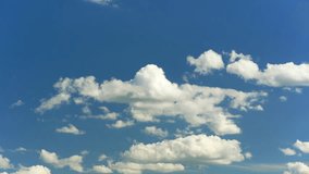 Floating fluffy clouds. Beautiful sunny blue sky with wispy smoky white cumulus and cirrus on different layers. Timelapse. - Powered by Shutterstock - Get 15% off with code: PIKWIZARD15