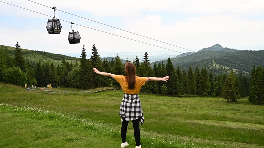 girl enjoying nature and clean air in the mountains