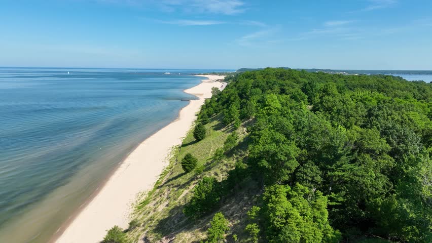 High aerial over the sloped downs with slight left movement.
