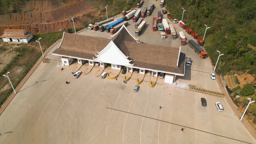Drone flying above trucks near the Chinese-Laotian Border, import and export checkpoint.