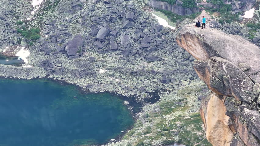 Hiking Above a Mountain Lake in the Summer
