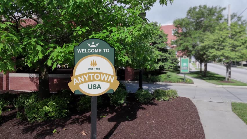 A generic "Welcome to Anytown USA" sign in middle America. Sign contents are fictional and is changeable upon request.  	