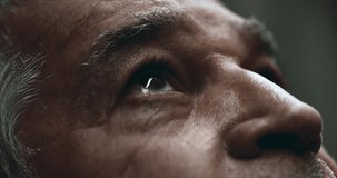 Elderly man close-up eyes gazing UPWARDS at sky. Older 70s person looking up with wrinkled expression in quiet contemplation - Powered by Shutterstock - Get 15% off with code: PIKWIZARD15