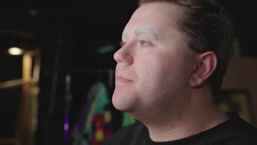 rubbing serum into cheeks vigorously