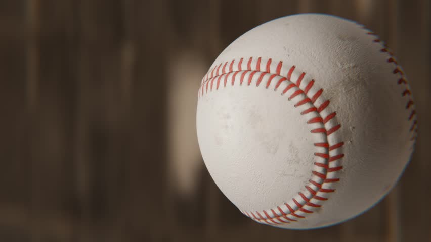 Baseball ball in focus, rotating in 360 degrees, Loop able video background 