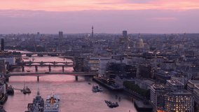Illuminated London cityscape at twilight and bridges spanning Thames, aerial - Powered by Shutterstock - Get 15% off with code: PIKWIZARD15