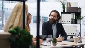 Financial advisor presenting detailed financial market analysis to clients, helping them make informed investment decisions. Broker providing customers with financial analysis, camera A - Powered by Shutterstock - Get 15% off with code: PIKWIZARD15