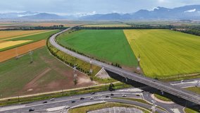 Left to right drone panning video of highway near Brasov