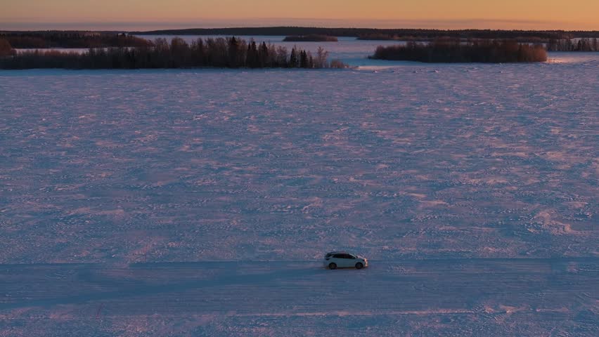 Driving on the frozen sea of ​​the Gulf of Bothnia in Lulea in Sweden. Gateway to Lapland in winter. Driving on ice in the largest saltwater archipelago in the world with 1,312 islands. Frozen sea.
