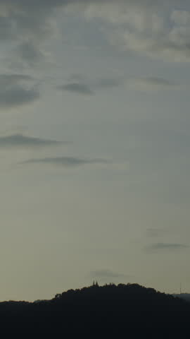 Twilight and dawn sky with cumulus cloud vertical time lapse in an evening.