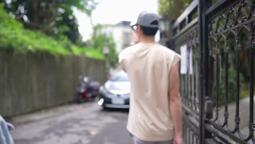 Slow-motion footage showcases a happy Taiwanese couple in their 20s exploring Xinyi District, Taipei. Their affectionate gestures and smiles reflect the area