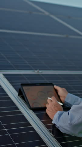 Solar engineer working with digital tablet at renewable energy farm. Alternative Eco energy concept