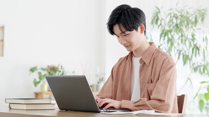 Man using laptop at home