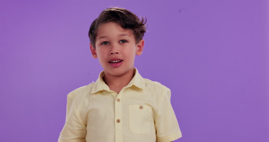 Wow, shock or child with hands on face in studio for news, information and unexpected announcement on purple background. Surprise, portrait or boy kid with emoji sign for oops, gossip or secret drama