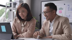 Colleagues in an office meeting collaborate on a digital tablet, discussing and pointing at the screen. Teamwork, communication, and technology in a professional setting - Powered by Shutterstock - Get 15% off with code: PIKWIZARD15