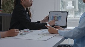 Diverse team analyzing colorful business data on a laptop and discussing strategies during a meeting in a modern office - Powered by Shutterstock - Get 15% off with code: PIKWIZARD15