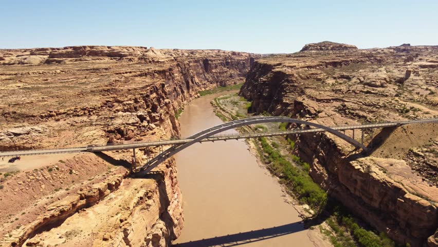 Aerial view of Colorado River and Utah State Route 95, Hite Crossing bridge with scenic rock formations, Lake Powell, Utah, United States.