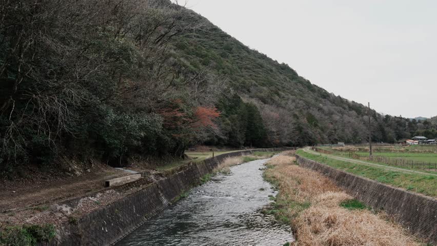 Rural scenery with mountains and rivers running through it