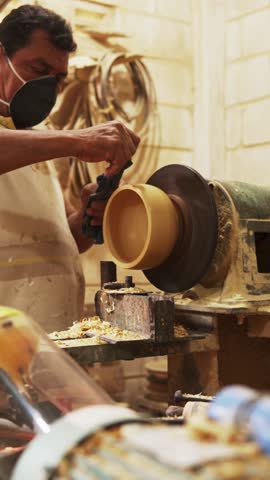 carving wooden plate in the workshop in colombia