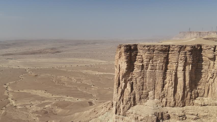 See amazing views of the Arabian Desert and Riyadh city with a drone video! Fly over the tall cliffs called Edge of the World and the sandy mountains of Tuwaiq