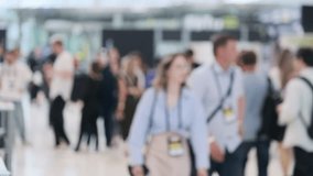 Blurred image of a busy crowd at a technology event or conference exhibition, showcasing attendees and networking opportunities. - Powered by Shutterstock - Get 15% off with code: PIKWIZARD15
