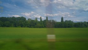 View from the window of high speed train. Beautiful trip with countryside scenery, clouds. A view of France landscape from the window of high speed train - Powered by Shutterstock - Get 15% off with code: PIKWIZARD15
