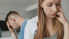Unhappy, sad and upset couple in argument with disappointed woman looking down and her man on background after conflict and quarrel. Angry girl thinking of relationship problems with boyfriend - Powered by Shutterstock - Get 15% off with code: PIKWIZARD15