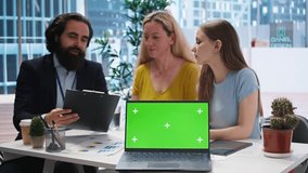 Financial advisor showing data graphs on green screen notebook to customers, analyzing market trends to do forecasting. Clients checking investment plan on chroma key laptop, camera A - Powered by Shutterstock - Get 15% off with code: PIKWIZARD15