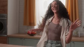 Hispanic woman Latina girl Caucasian female housewife homeowner at home kitchen own apartment house rent relocation moving day having fun morning dancing moving music listening dance funny happy move - Powered by Shutterstock - Get 15% off with code: PIKWIZARD15