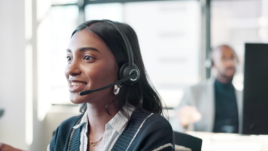 Employee, Indian woman and microphone at call center with chat for customer support and service. Office, crm and advisor or consultant in conversation, telemarketing and communication at help desk
