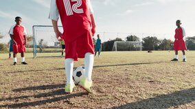 Kick, football player and children in stadium for score, practice and exercise for sport competition. Soccer field, goalkeeper and kids athletes for training, shooting and motor coordination for girl - Powered by Shutterstock - Get 15% off with code: PIKWIZARD15