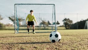 Kick, soccer player and kid in stadium for score, practice and exercise for sport competition. Football field, goalkeeper and boy athlete for training, shooting and motor coordination for game - Powered by Shutterstock - Get 15% off with code: PIKWIZARD15