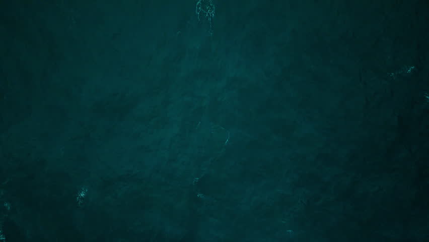 Dark ocean water surface background from above, Aerial top view
