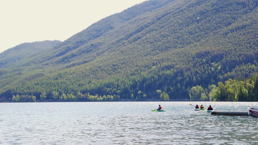 People Kayaking on Lake McDonald in Glacier National Park, Montana