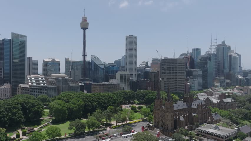 Aerial drone view of Hyde Park, Australia, with iconic landmarks: the Sydney Tower Eye, St. Mary