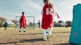 Football, player and children in stadium for shooting, practice and exercise for sport competition. Soccer field, goalkeeper and kids athletes for training, kick and motor coordination with scoring - Powered by Shutterstock - Get 15% off with code: PIKWIZARD15
