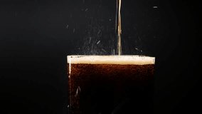 Pouring cola into a glass. Cola with ice and bubbles in glass. Soda close-up. Food background. Turning a glass of cola. Macro photography. Close-up. - Powered by Shutterstock - Get 15% off with code: PIKWIZARD15