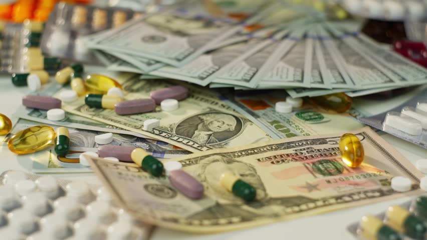 Background Video of Money and Antibiotic Pill Boxes - Concept of Expensive Medical Treatment. High quality 4k footage
