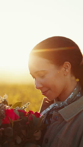 Face, flowers and thinking with a black woman at sunset, looking happy outdoor in nature for romance. Smile, spring and rose bouquet with a happy young person in the countryside on valentines day
