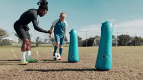 Boy, ball and training for soccer with coach on field with kick, inflatable and running with fitness. Football club, child and skill for match workout, drill and player on grass for sport or exercise - Powered by Shutterstock - Get 15% off with code: PIKWIZARD15