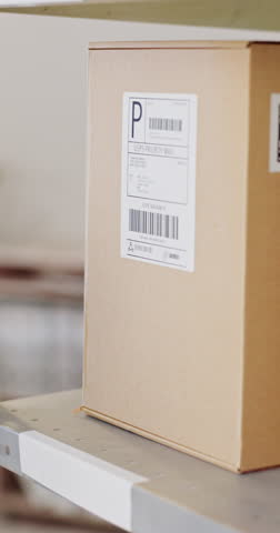 Hand, package or box with scanner for logistics, delivery or shipment of order in closeup. Small business, employee and inspection of price, barcode or information of inventory for customer in office