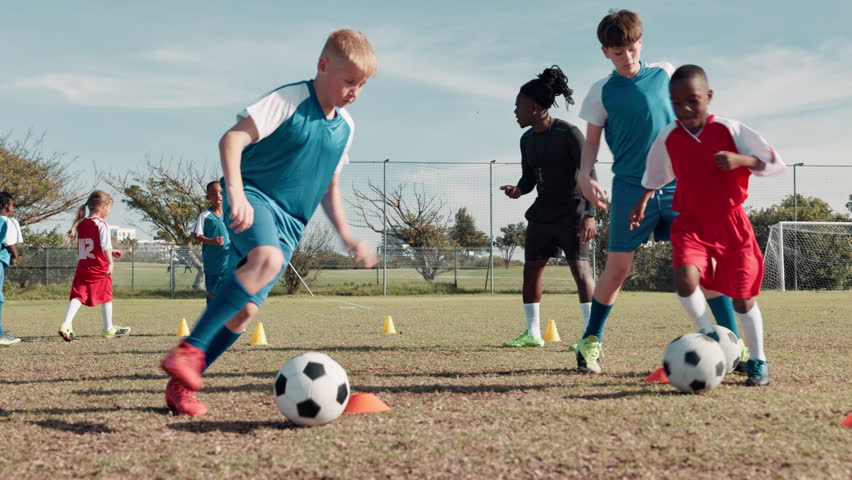 Soccer ball, sports and children dribble for training, workout and exercise for practice, learning and fitness. Youth, field and kids with coach and equipment for playing games, match and competition