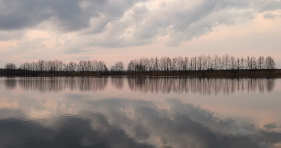 beautiful sunset sky on the lake, reflection of the sky in the lake at sunset