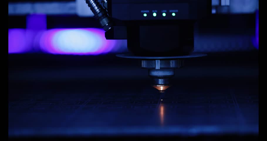 Laser CNC cut of metal with light spark. Blue color background banner, technology modern industrial.