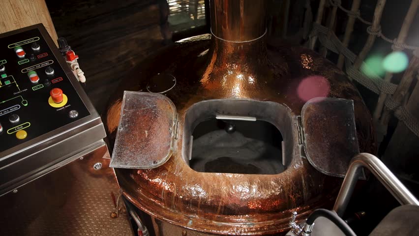 Beer making in craft brewery, Kettle with beer inside. Modern beer factory. Huge steel tanks for brewing. Beer Production Pouring Malt Grains Into A Large Grinding Tank At The Brewery - Powered by Shutterstock - Get 15% off with code: PIKWIZARD15