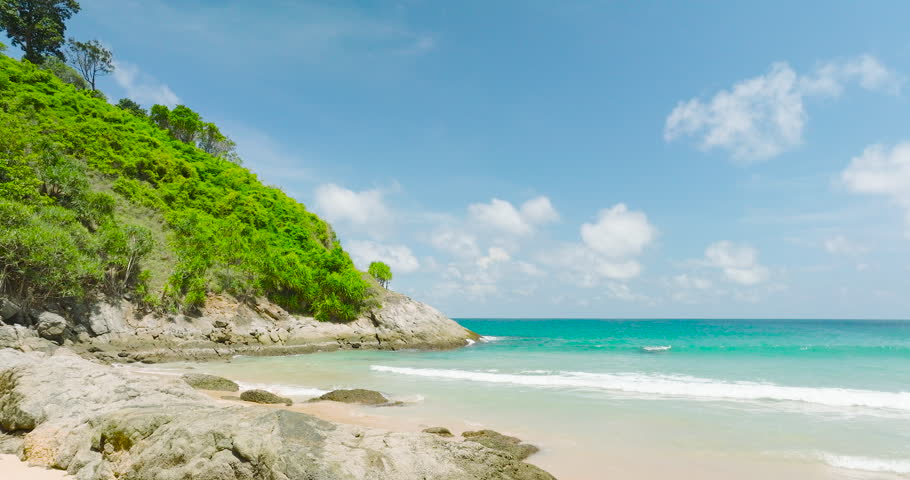 Phuket, Thailand. Summer Phuket Beach And Sea. Landscape view of beach sea sand and sky in summer day. Beach space area. At Karon Beach, Phuket, Thailand. DCI4K ProRes422